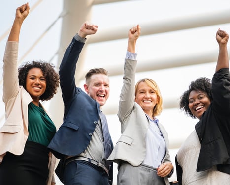 four business people with hand in air