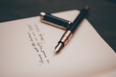 Fountain pen with writing on card