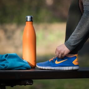 orange water bottle with women